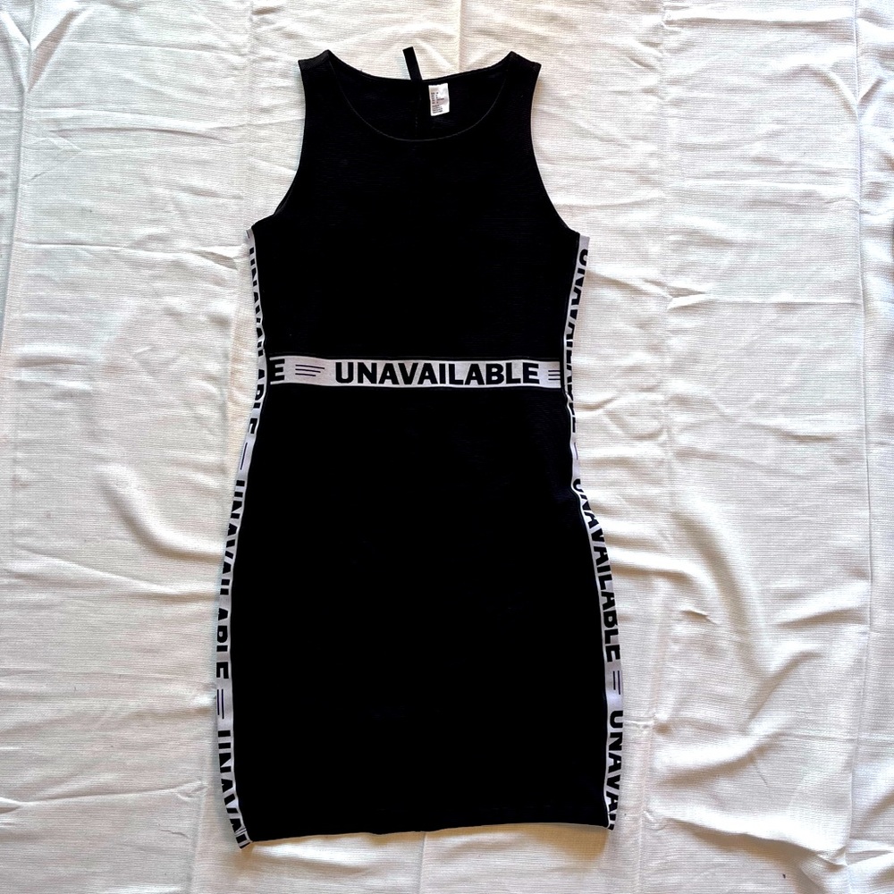 Little mini black dress with “UNBELIEVABLE” along sides and waist!